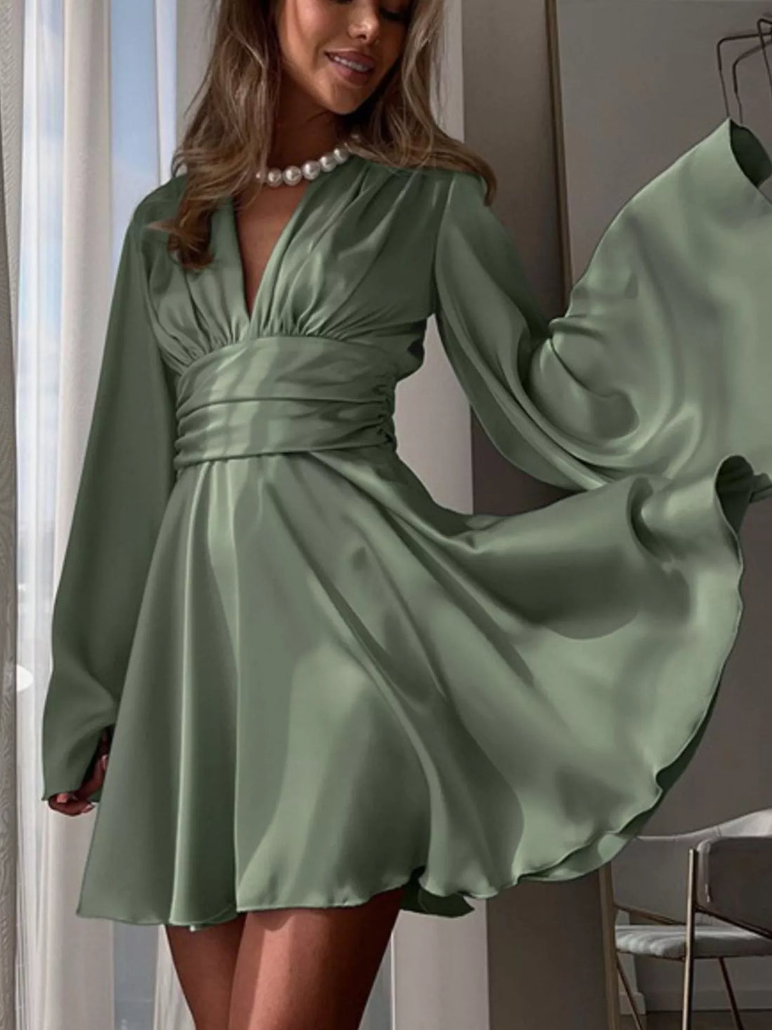 V-neck satin mini dress with flowy sleeves for a holiday party