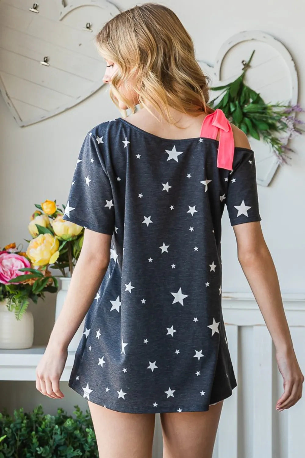 Full Size Star Print Asymmetrical Neck Short Sleeve Top detail — Livostyle