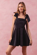 Fit and Flare Washed Gameday Dress with Frill and Bow Details in Black