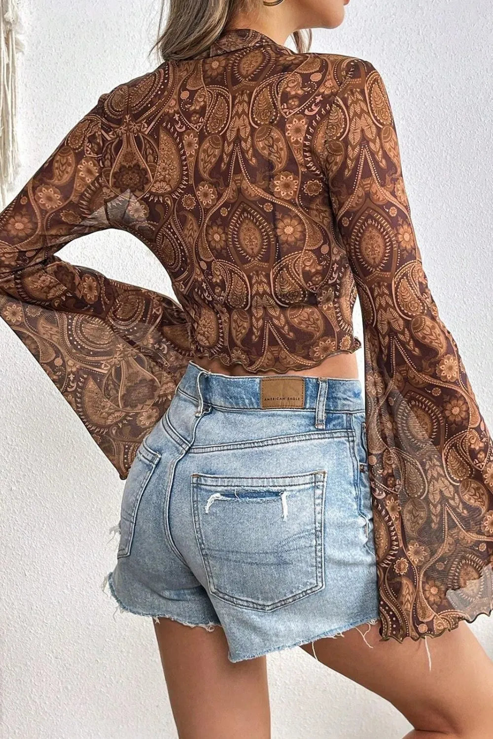 Printed Mock Neck Flare Sleeve Top detail — Livostyle