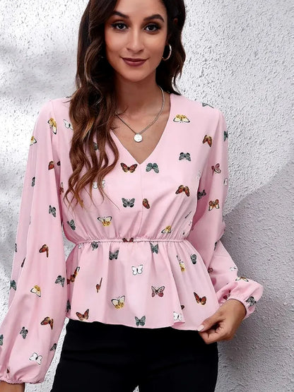 Chic Butterfly Peplum Blouse with Balloon Sleeves — detail view — Livostyle