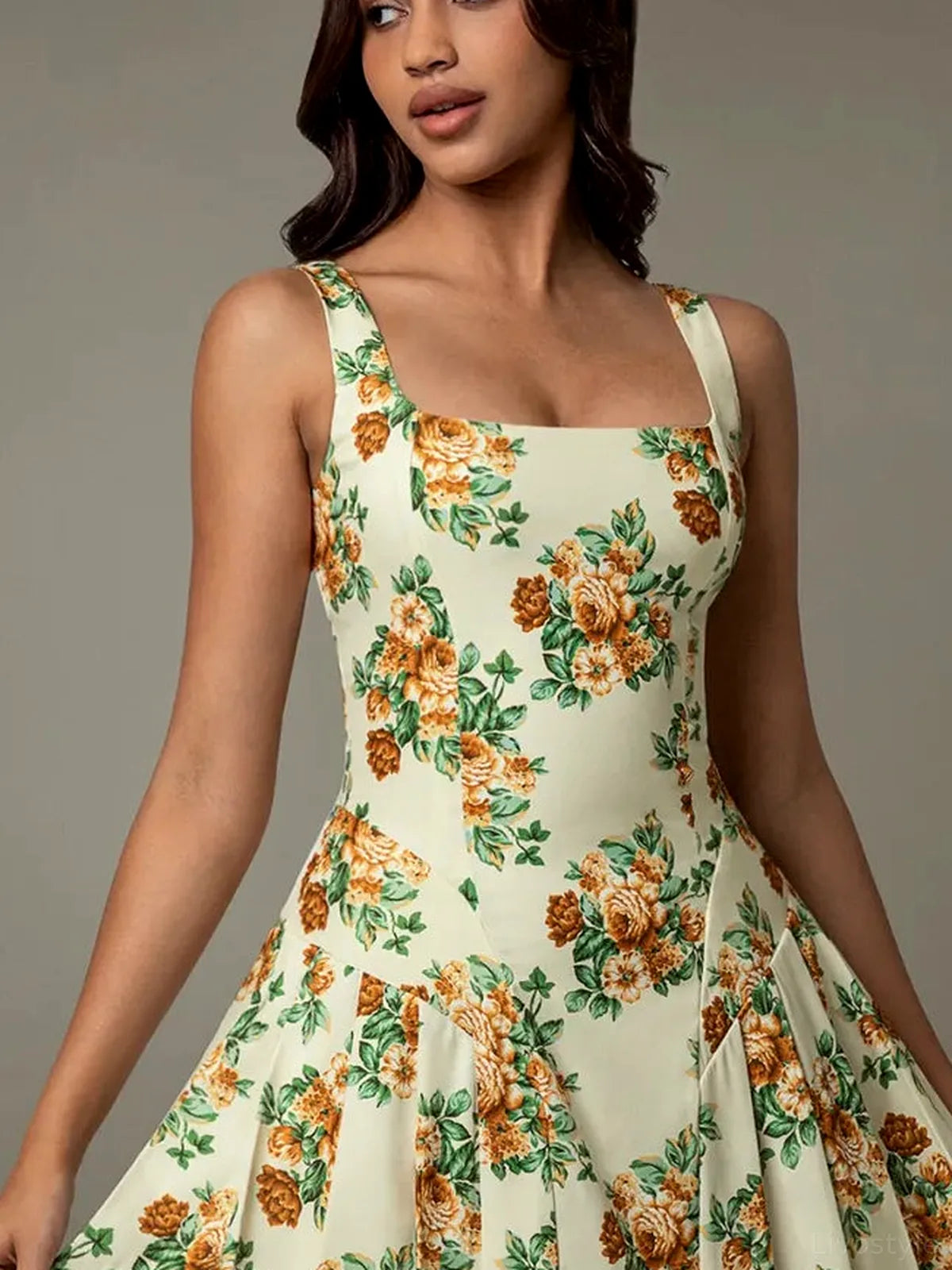 Elegant Floral Print Pleated Mini Dress with Stretch — detail view — Livostyle