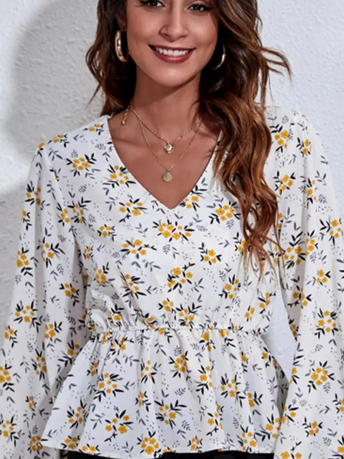 Chic Floral Peplum Blouse with Balloon Sleeves — detail view — Livostyle