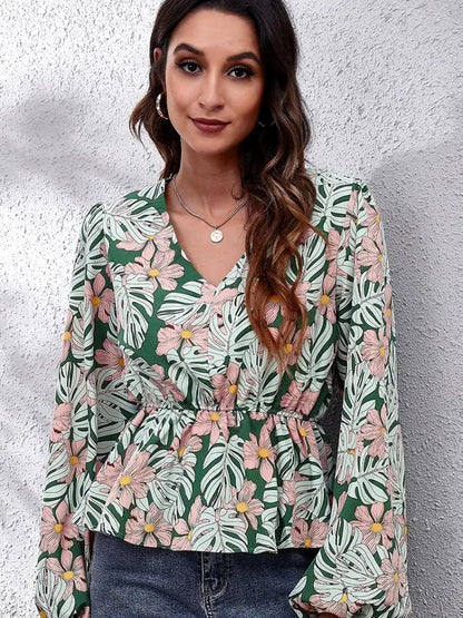 Chic Floral Peplum Blouse with Balloon Sleeves & V-Neck — detail view — Livostyle