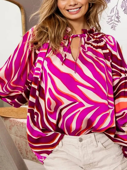 Chic Zebra Print Satin Top with Tied Neck and Balloon Sleeve — detail view — Livostyle