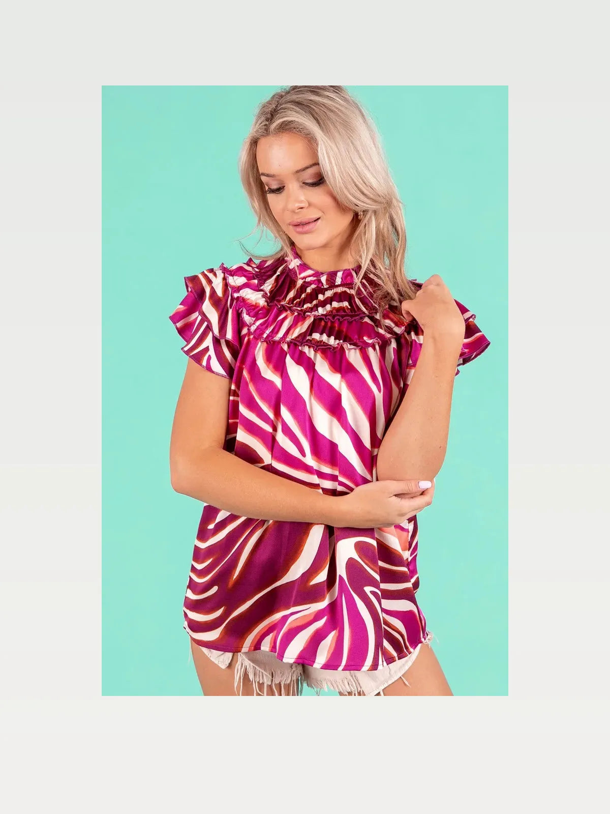 Trendy Zebra Print Top with Tiered Ruffle Neckline — styled showcase — Livostyle