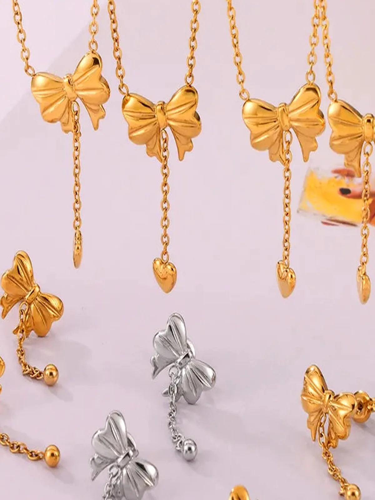 Titanium Steel Bow Earrings — detail view — Livostyle